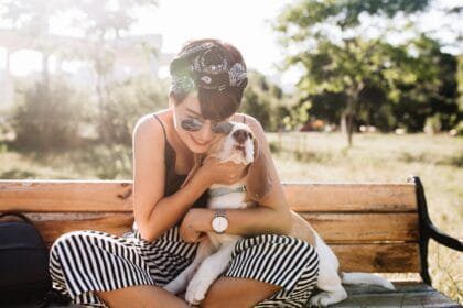 CBD oil feature image - woman hugging dog | Tailwaggors